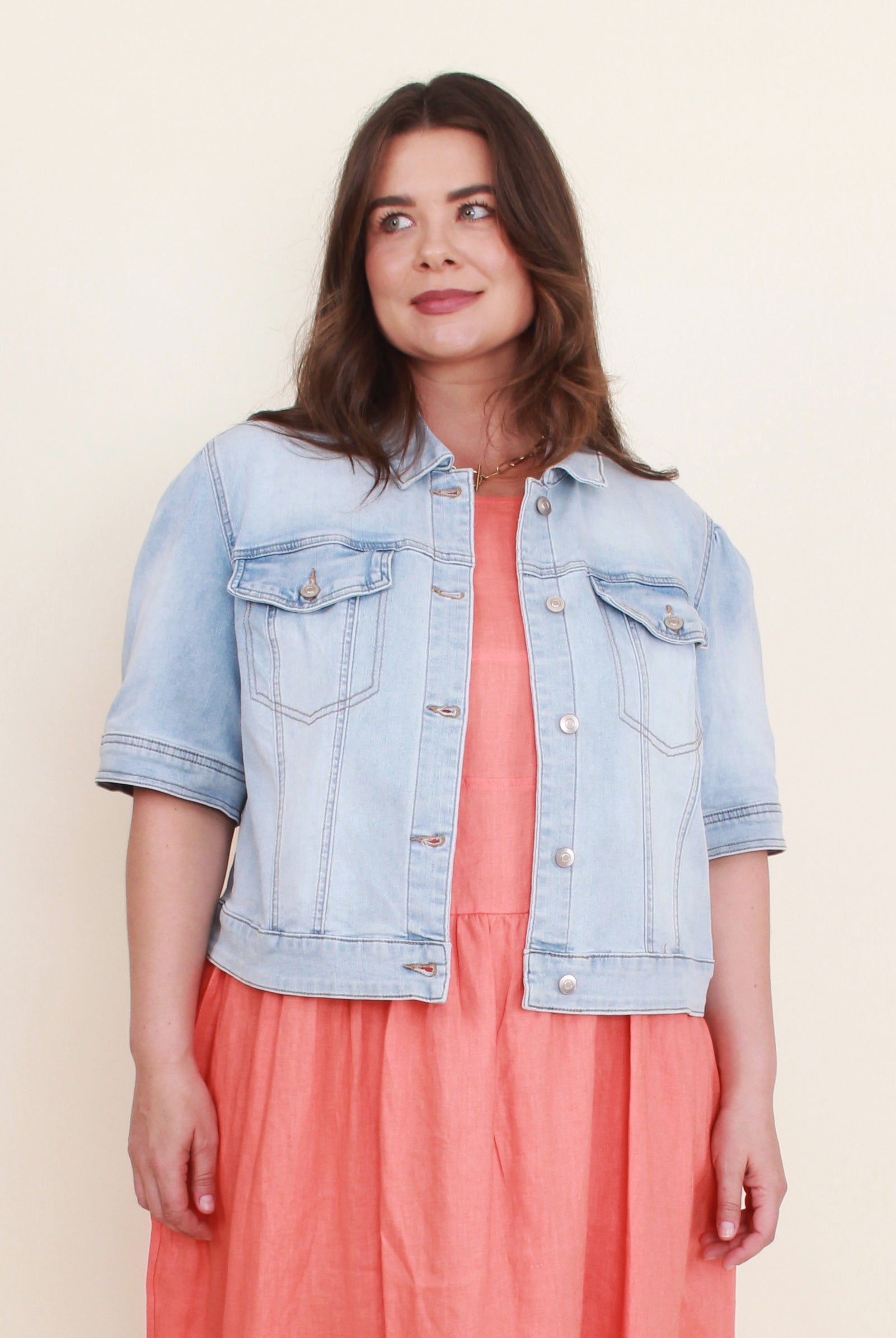 womens cropped denim jacket with coral dress worn by model