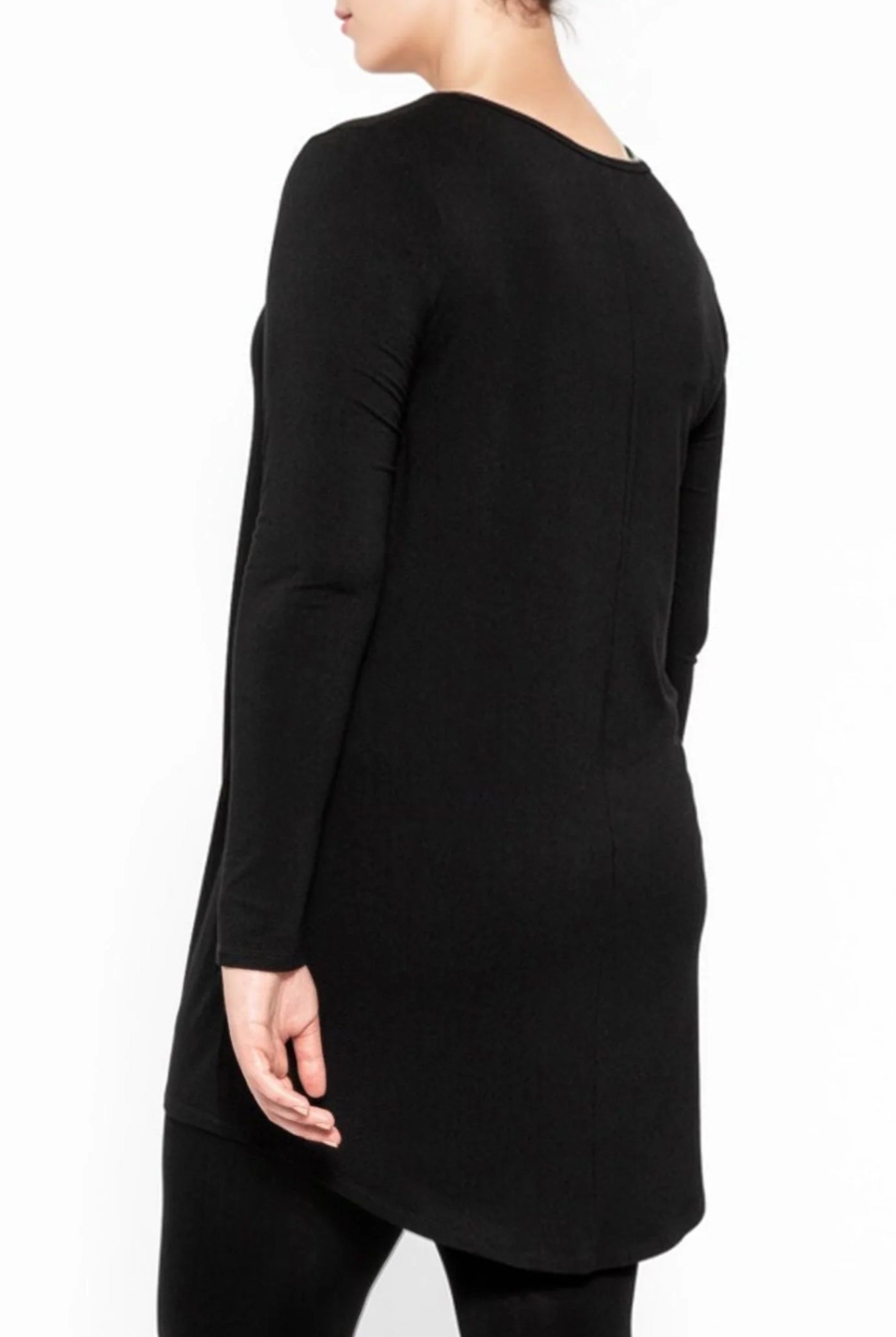 longline black top and black leggings worn by model back view