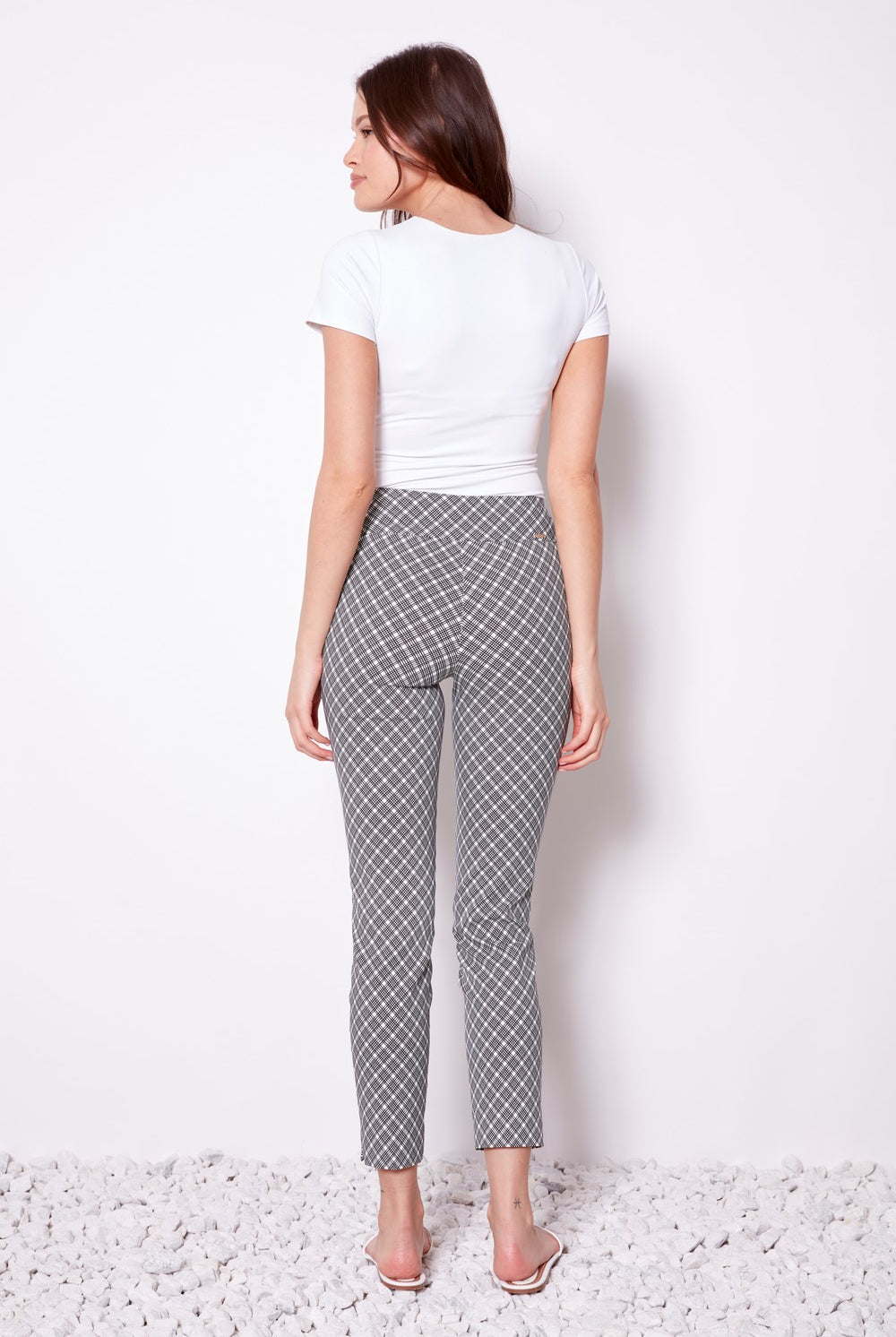 black and white geometric slim pant with white tee worn by model back view