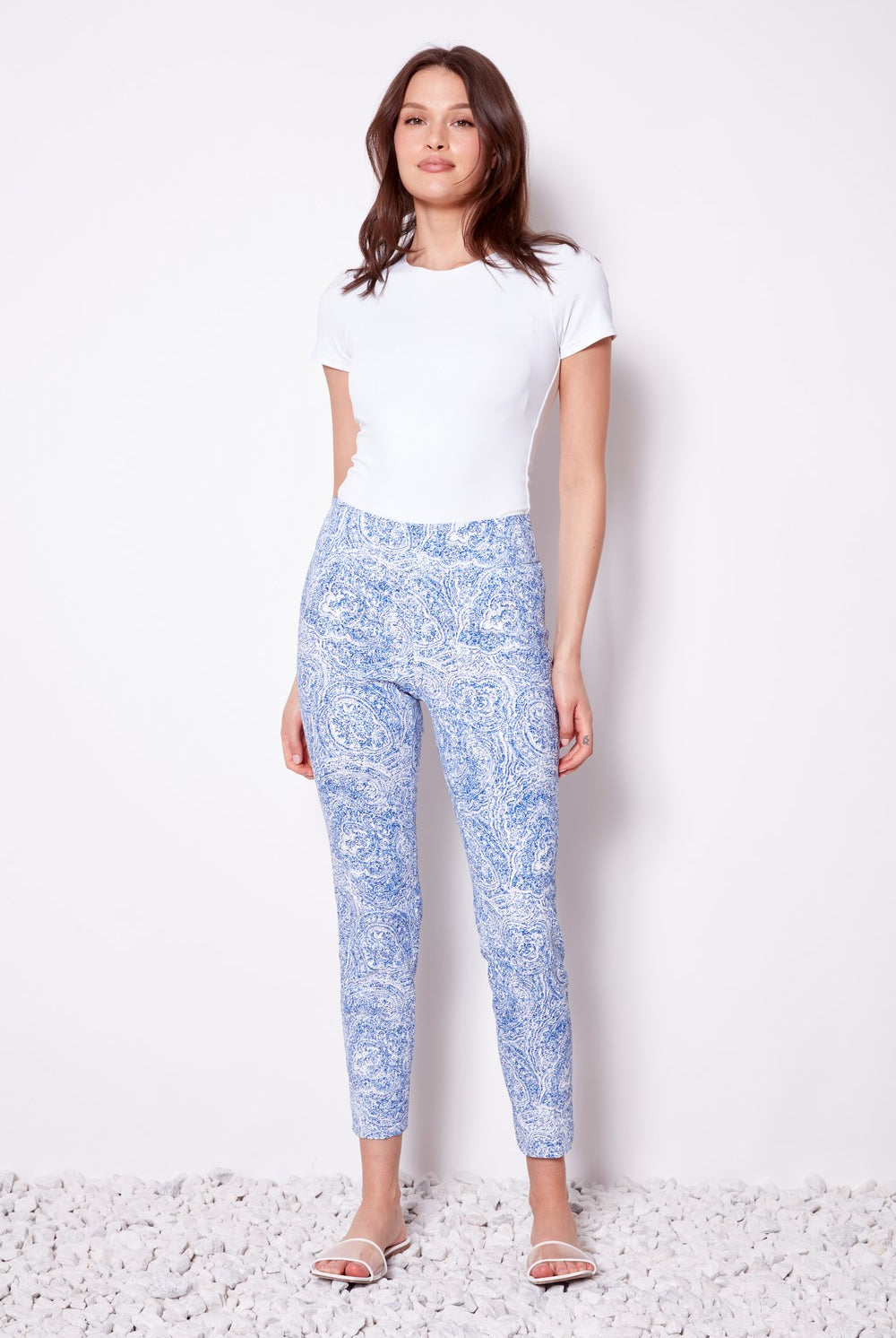 blue print pants and white top worn by model