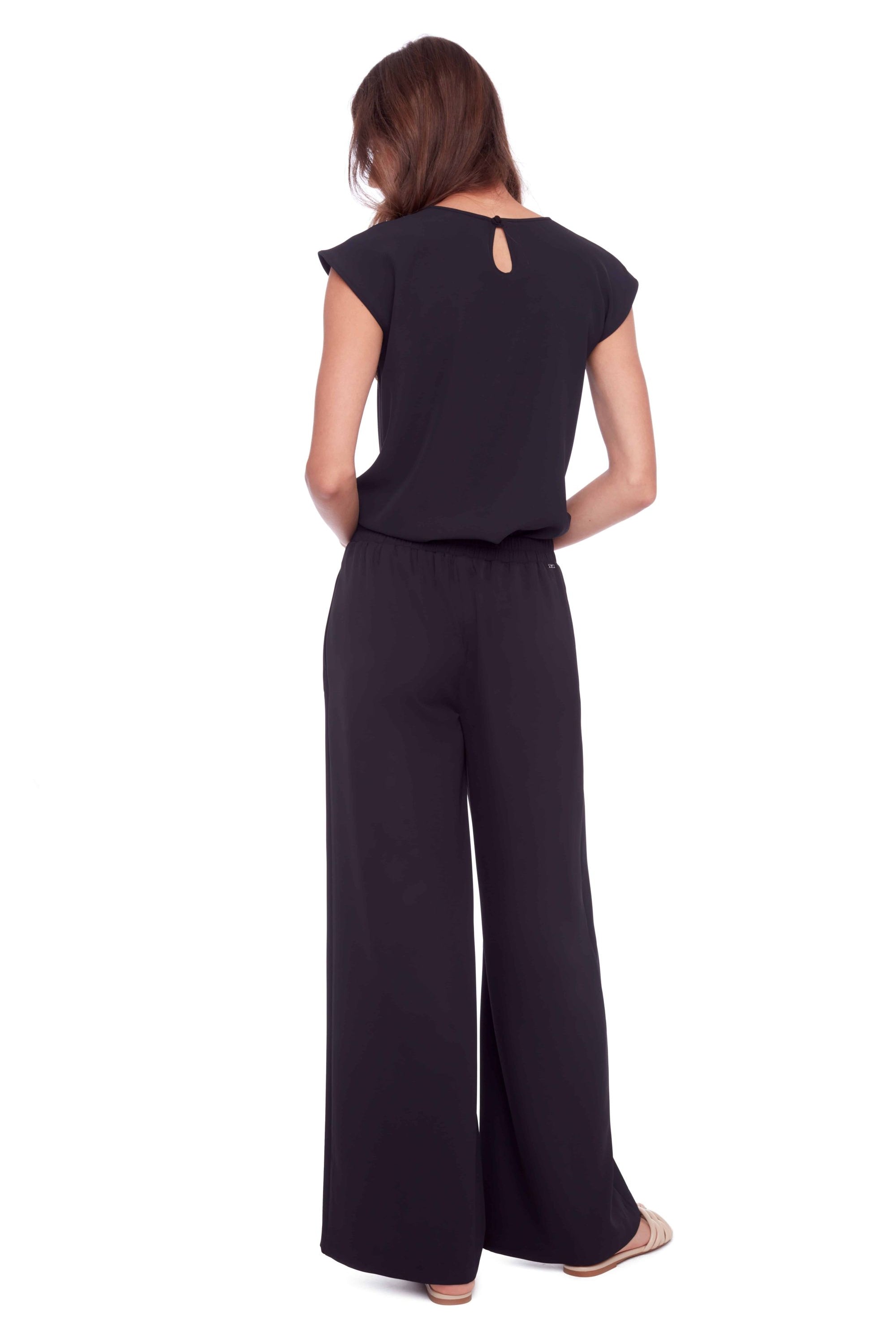 womens high waist wide leg black pants and black top worn by model back view