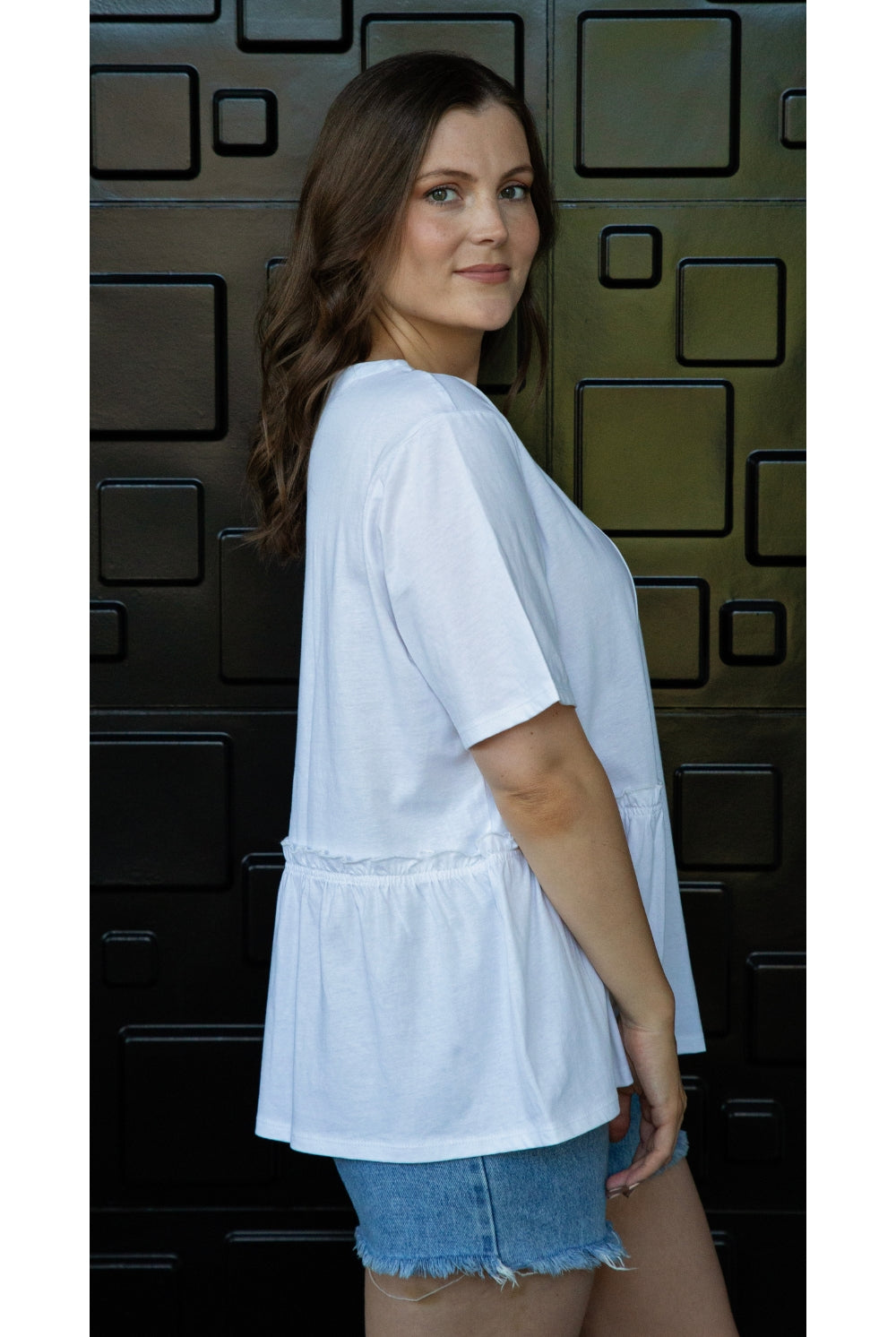 womens tee with gather detailing in white worn by model side view