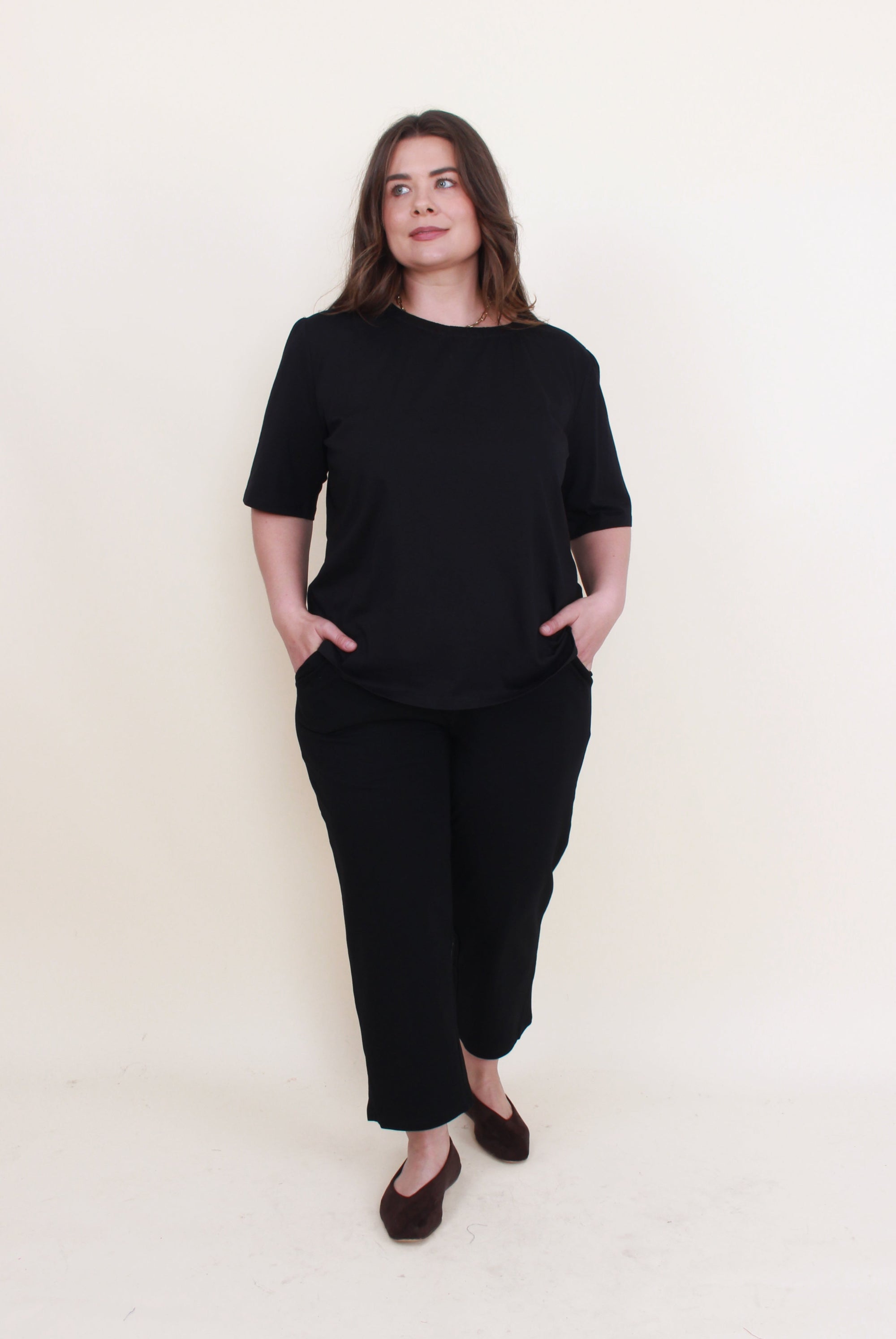 womens cropped black pant with black top worn by model