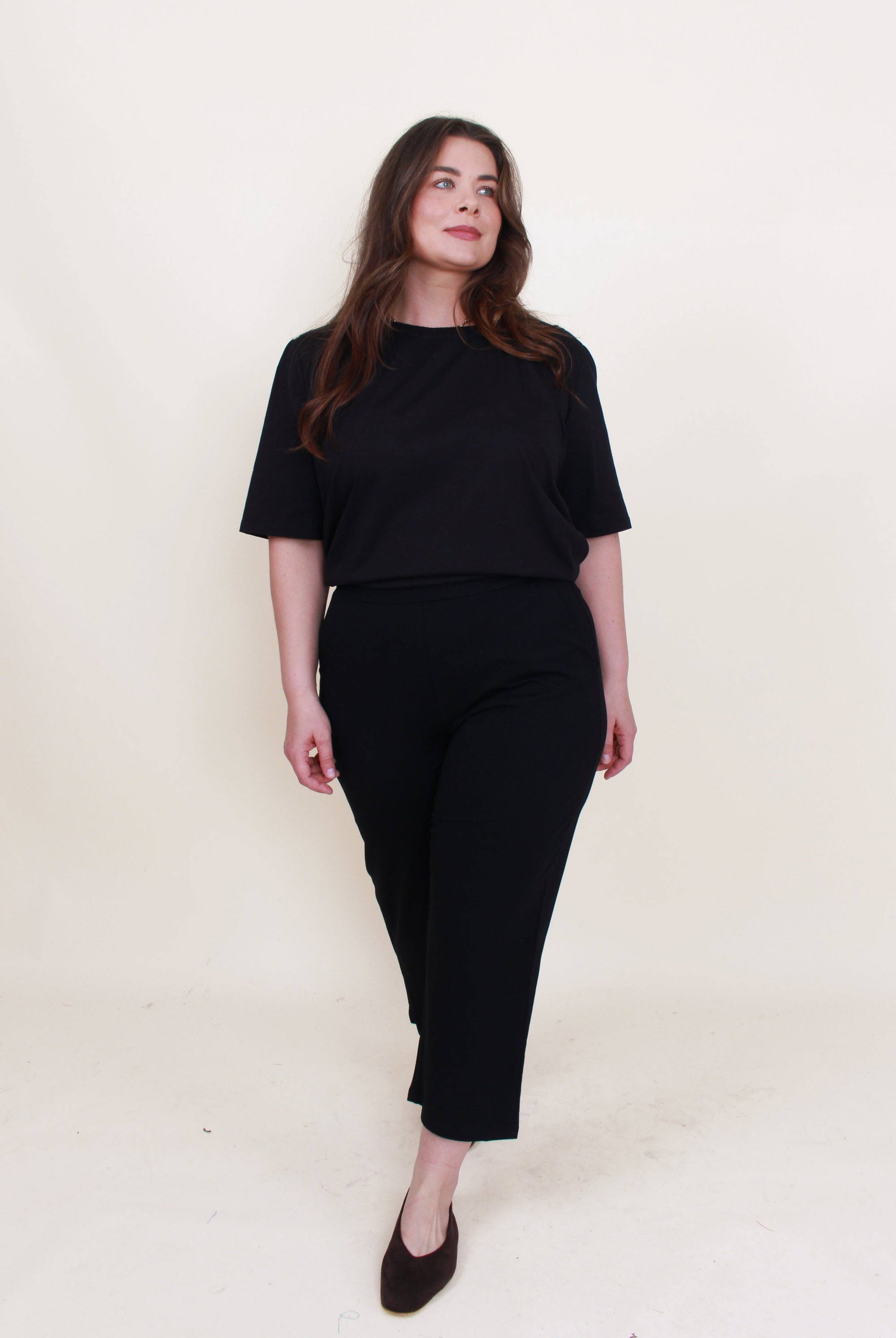 womens cropped black pant with black top worn by model