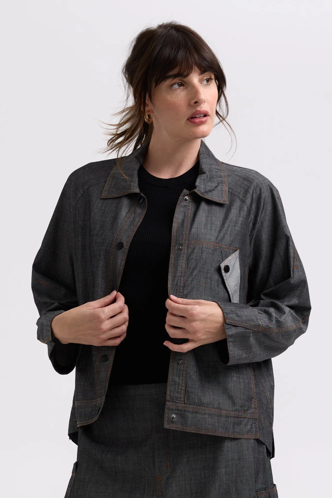 charcoal denim shaket worn by model on a white background