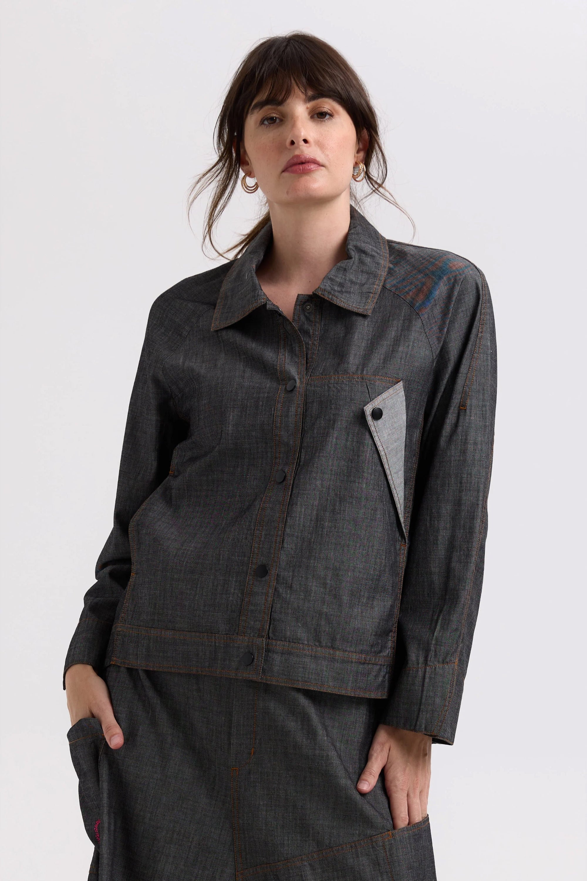 charcoal denim shaket worn by model on a white background