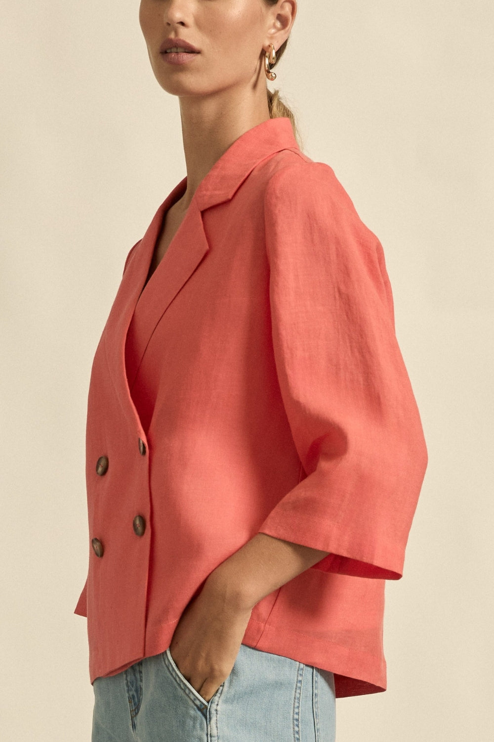 womens double breasted jacket in melon worn by model side view