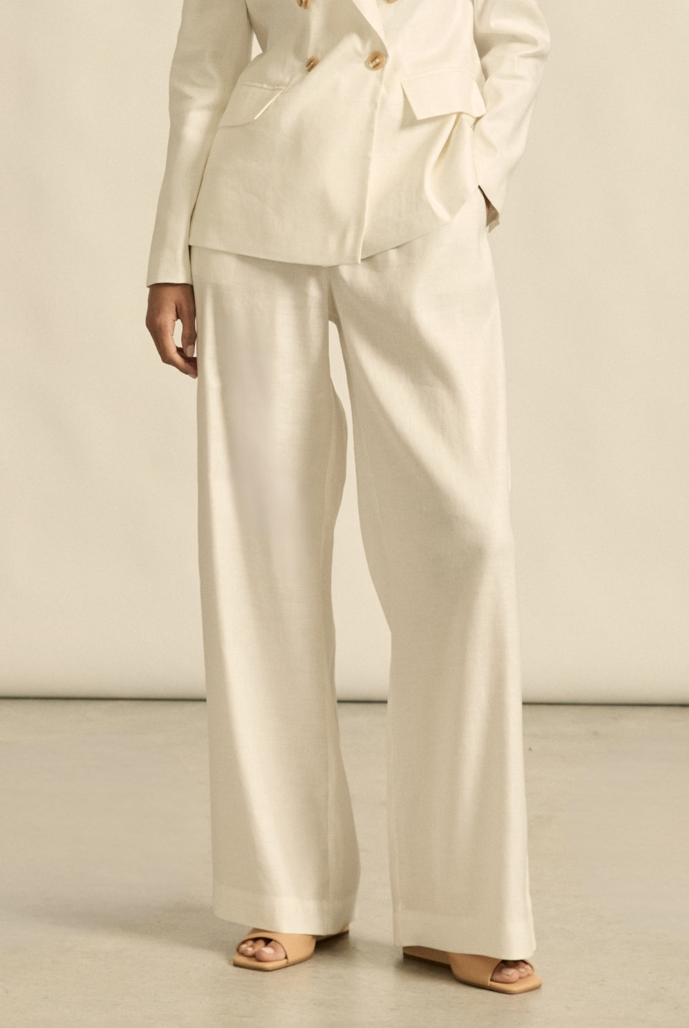 womens off white tailored relaxed pant worn by model