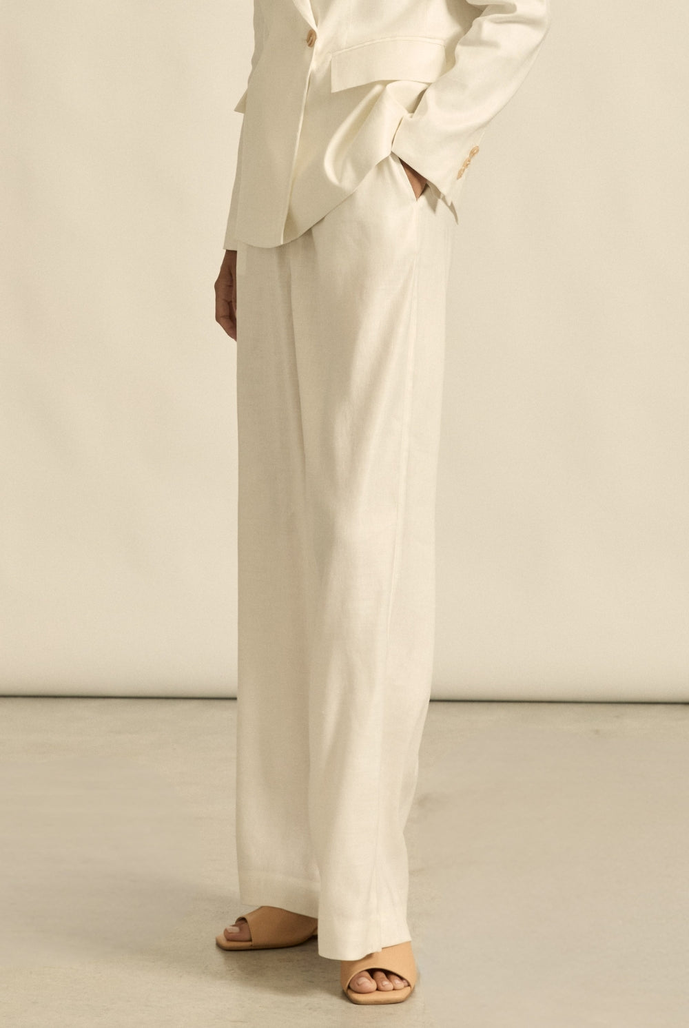 womens off white tailored relaxed pant worn by model