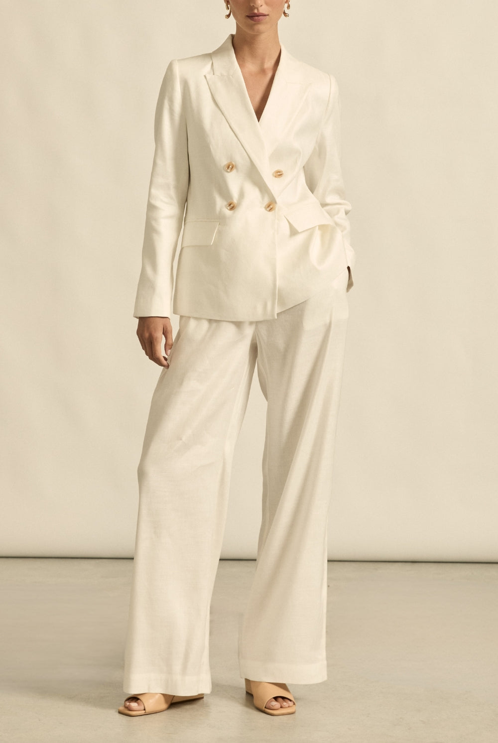 womens off white tailored relaxed pant and jacket worn by model