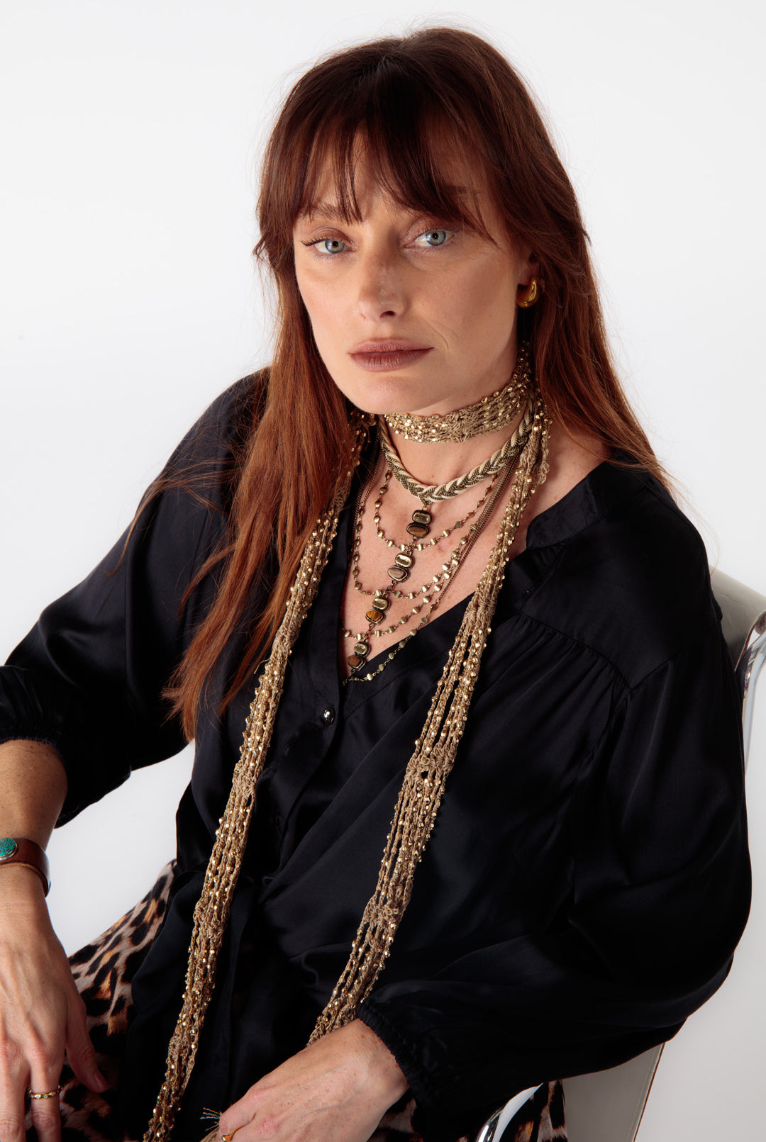 Close-up of elasticated sleeves and button detailing on the Ruby Yaya Gabor Shirt, styled with animal print pants