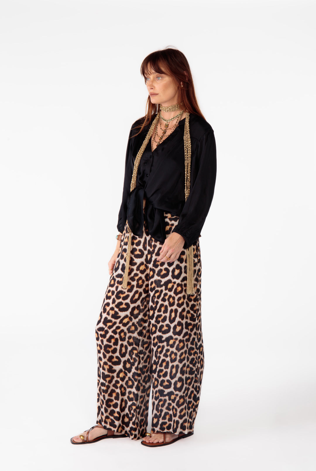 Soft black viscose shirt worn casually with leopard pants; showcasing versatile, easygoing style