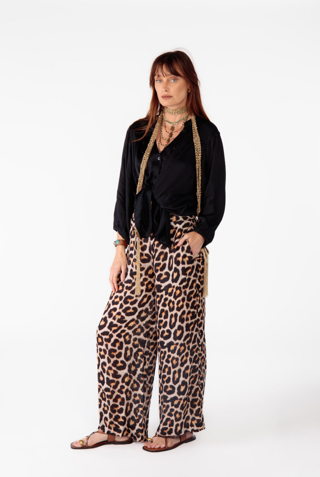 Woman pairs Ruby Yaya Gabor Shirt in black with bold leopard pants for an elevated casual outfit