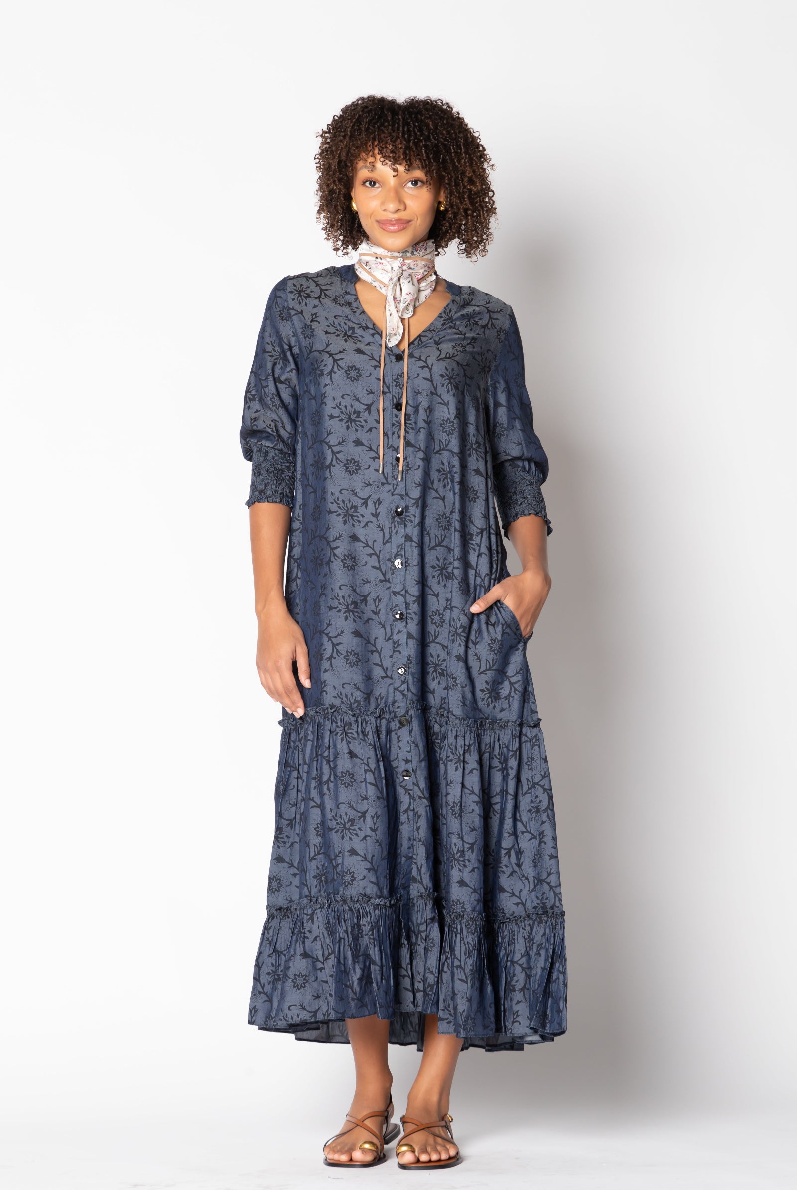 Model wearing Ruby Yaya Vaqueros Maxi Dress in navy denim – V-neck, button front, tiered skirt, 3/4 sleeves, and self belt