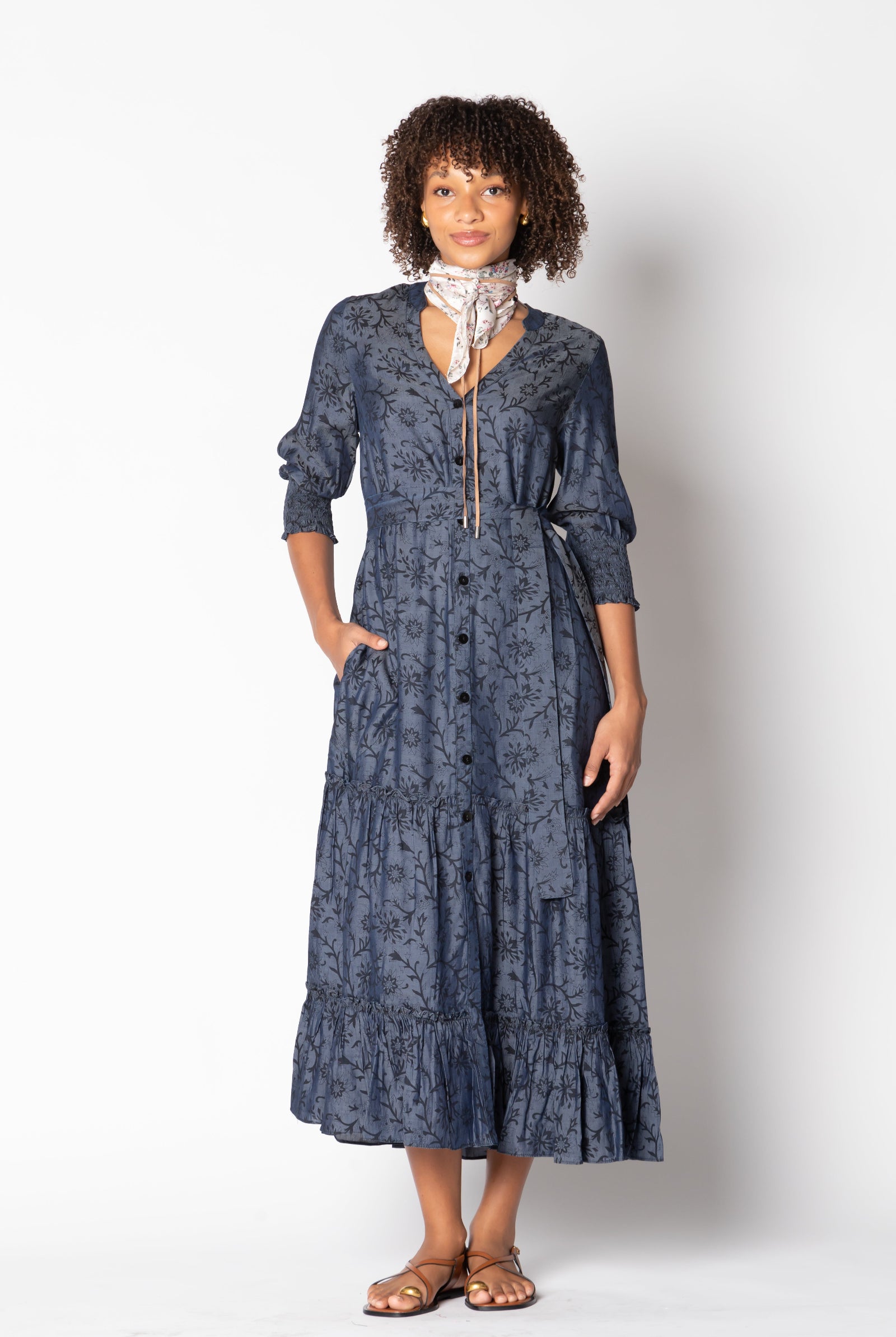 Model wearing Ruby Yaya Vaqueros Maxi Dress in navy denim – V-neck, button front, tiered skirt, 3/4 sleeves, and self belt