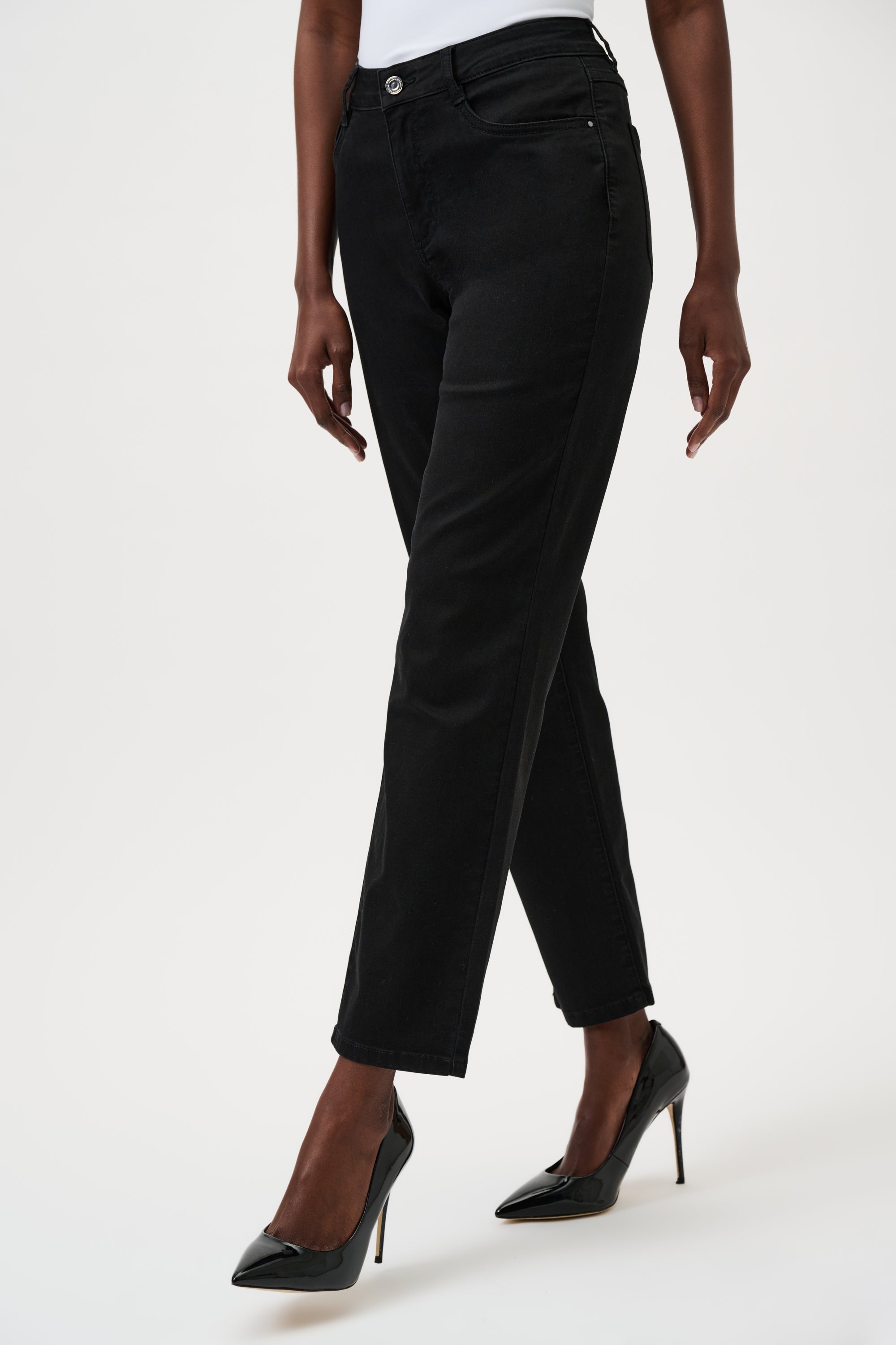 Person wearing black pants on a white background