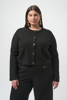 Woman wearing a black cardigan on a white background