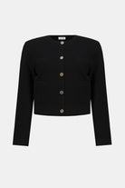Black cardigan with gold buttons on a white background