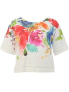 Colorful floral print shirt on a white background