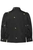 Black jacket with decorative appliques on a white background