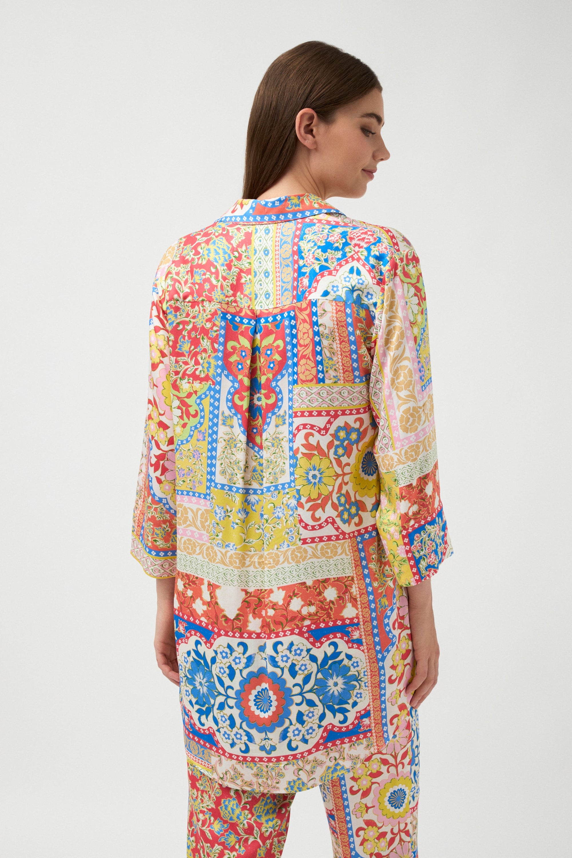 multi colour tile print shirt worn by model back view