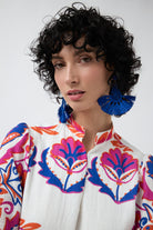 white with pink and blue print shift midi dress worn by model close up