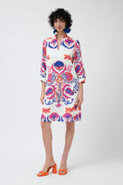 white with pink and blue print shift midi dress worn by model 