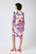 white with pink and blue print shift midi dress worn by model back view