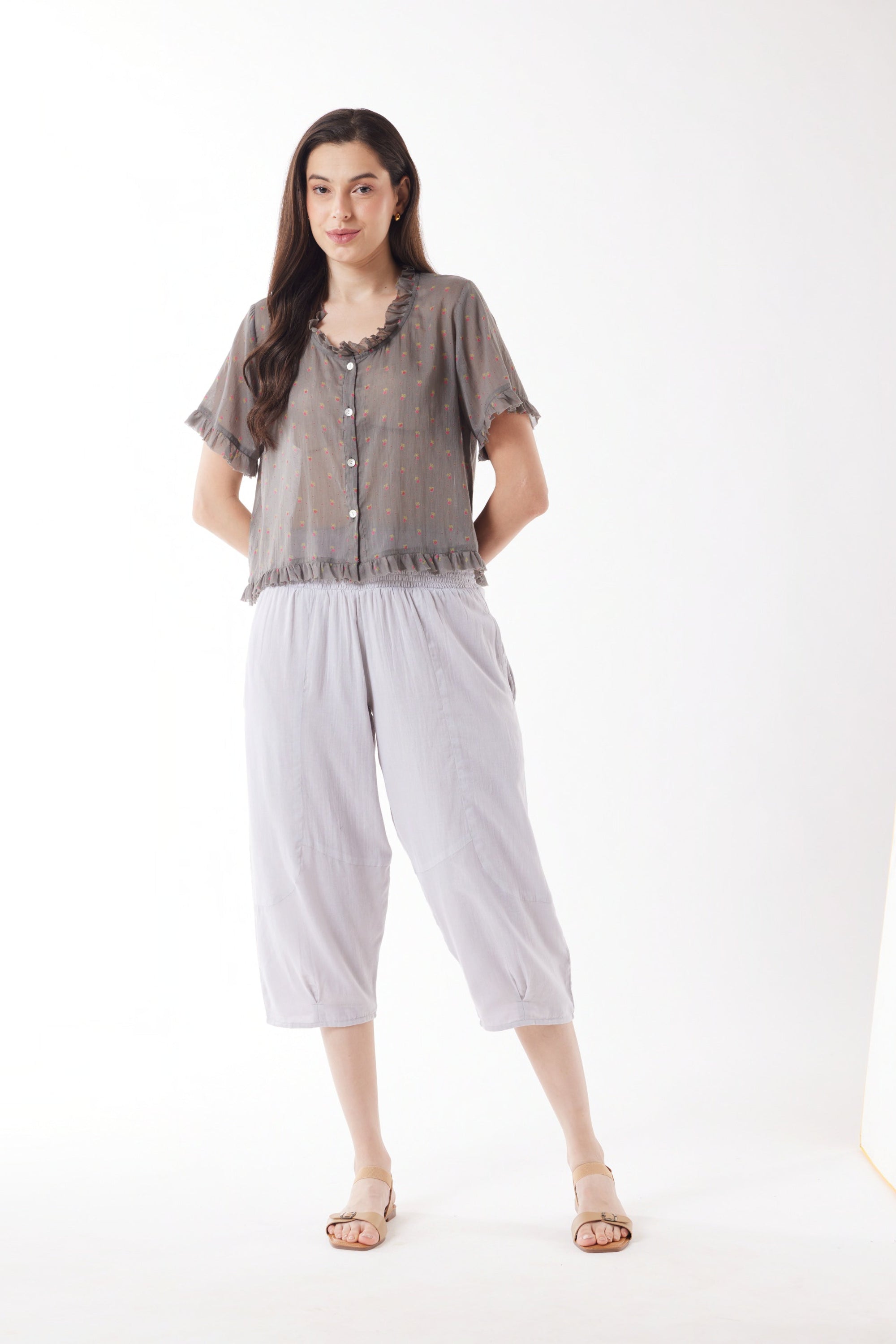 light grey capri pants and grey top worn by model 