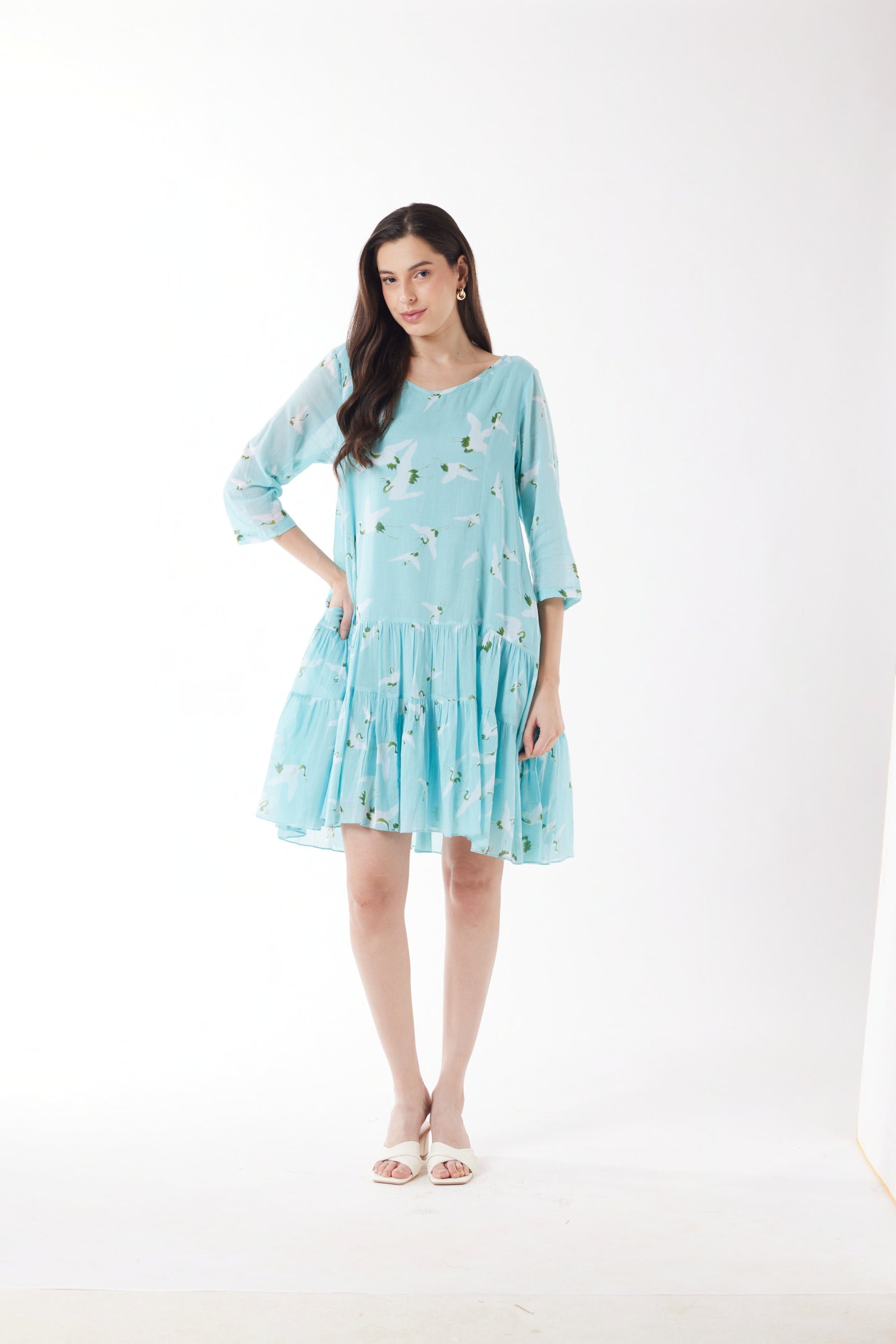 blue with white bird print midi dress worn by model 