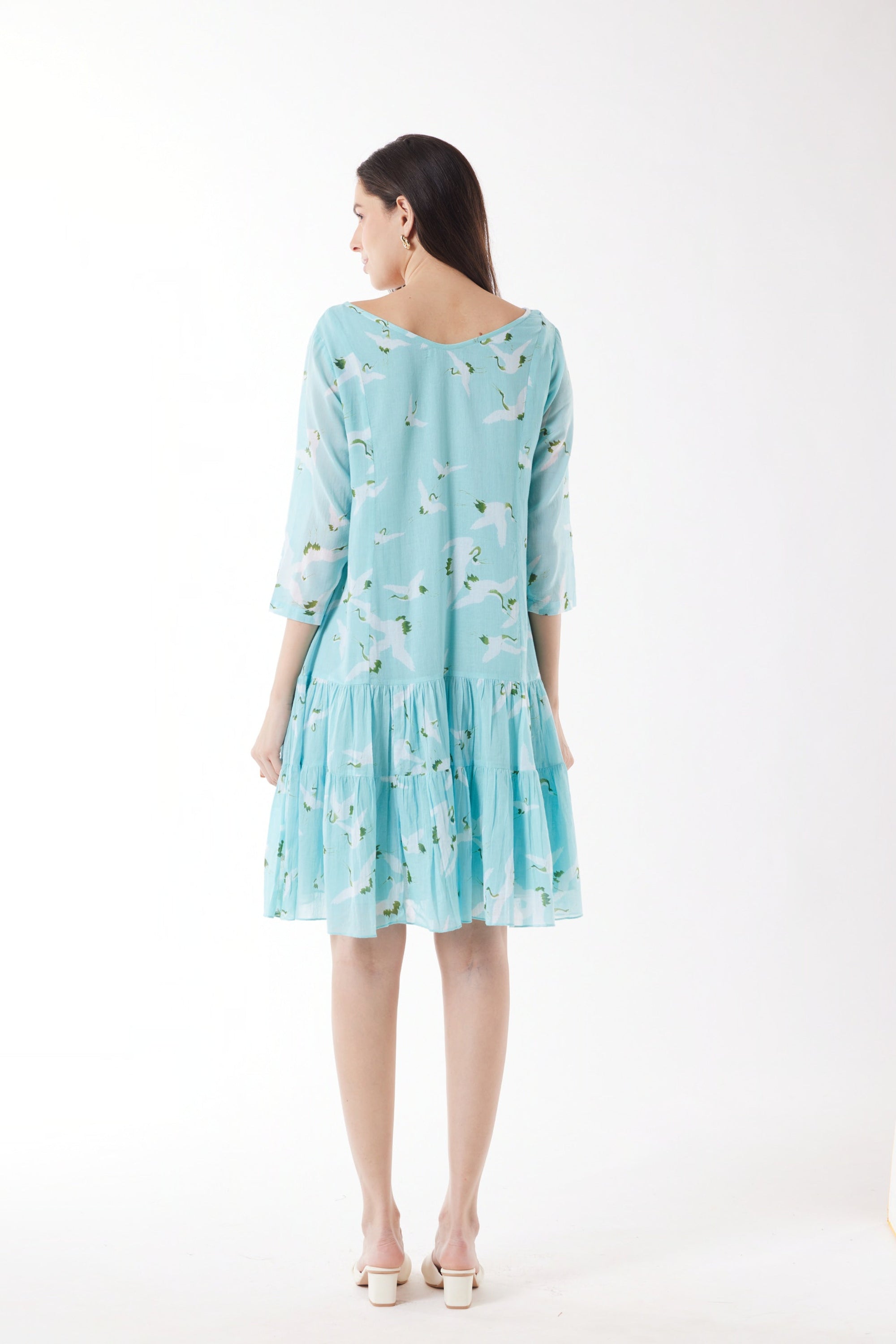 blue with white bird print midi dress worn by model back view