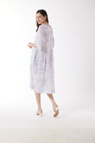 light grey print midi dress worn by model back view
