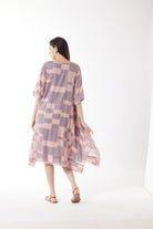 dusty pink purple block print midi dress worn by model back view