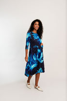womens smash pleat midi dress blue black floral worn by model