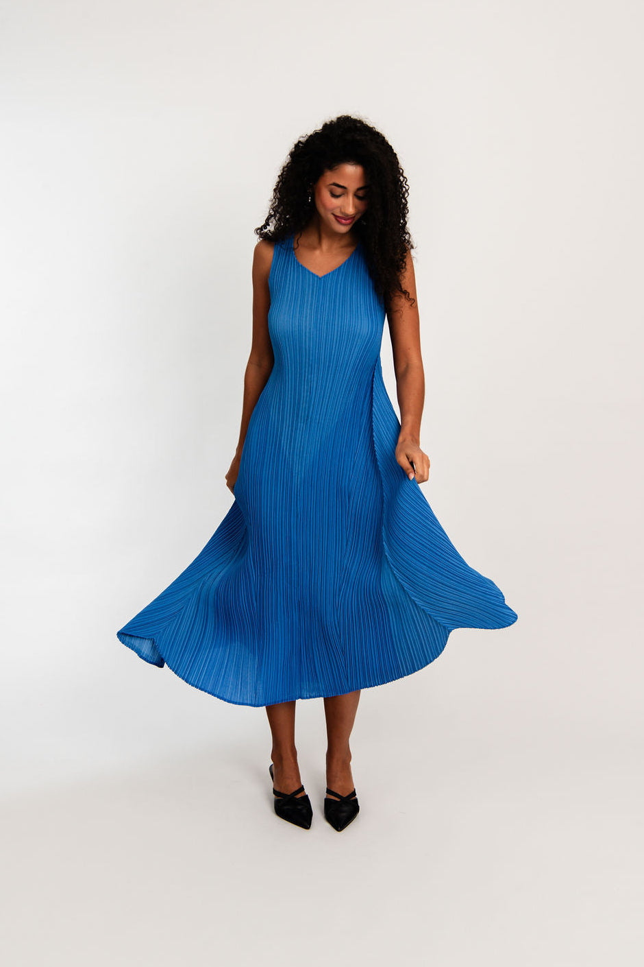 midi maxi pleated dress in royal blue worn by model
