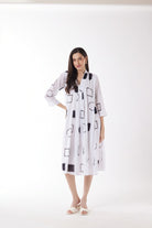 white midi dress with black geo print worn by model 