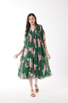 pleated midi dress emerald with roses worn by model 