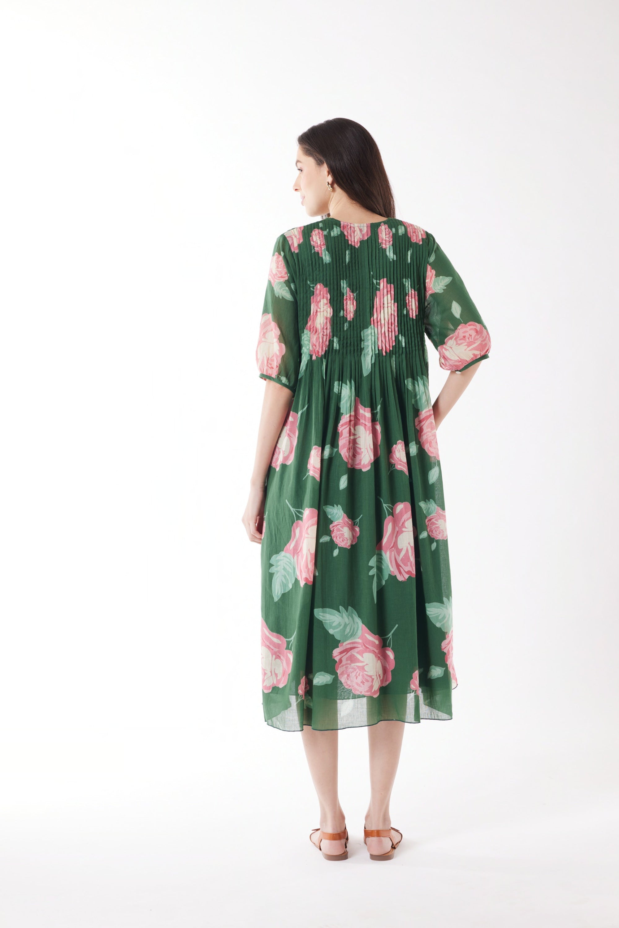 pleated midi dress emerald with roses worn by model back view