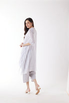 longline white grey stripe shirt and white pants worn by model back view