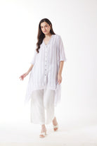 longline white grey stripe shirt and white pants worn by model 