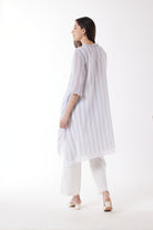 longline white grey stripe shirt and white pants worn by model back view