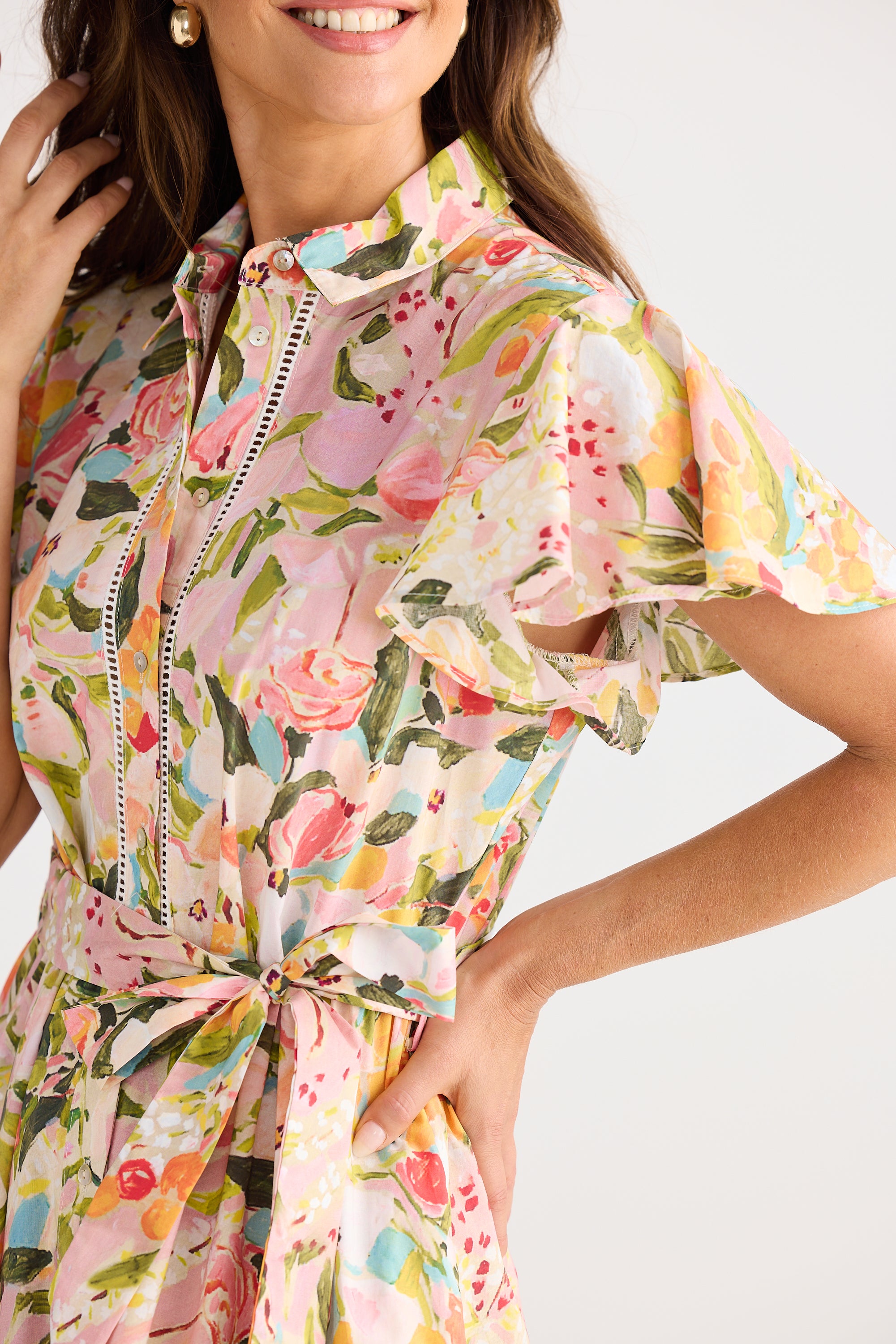 Woman wearing a floral dress with a white background