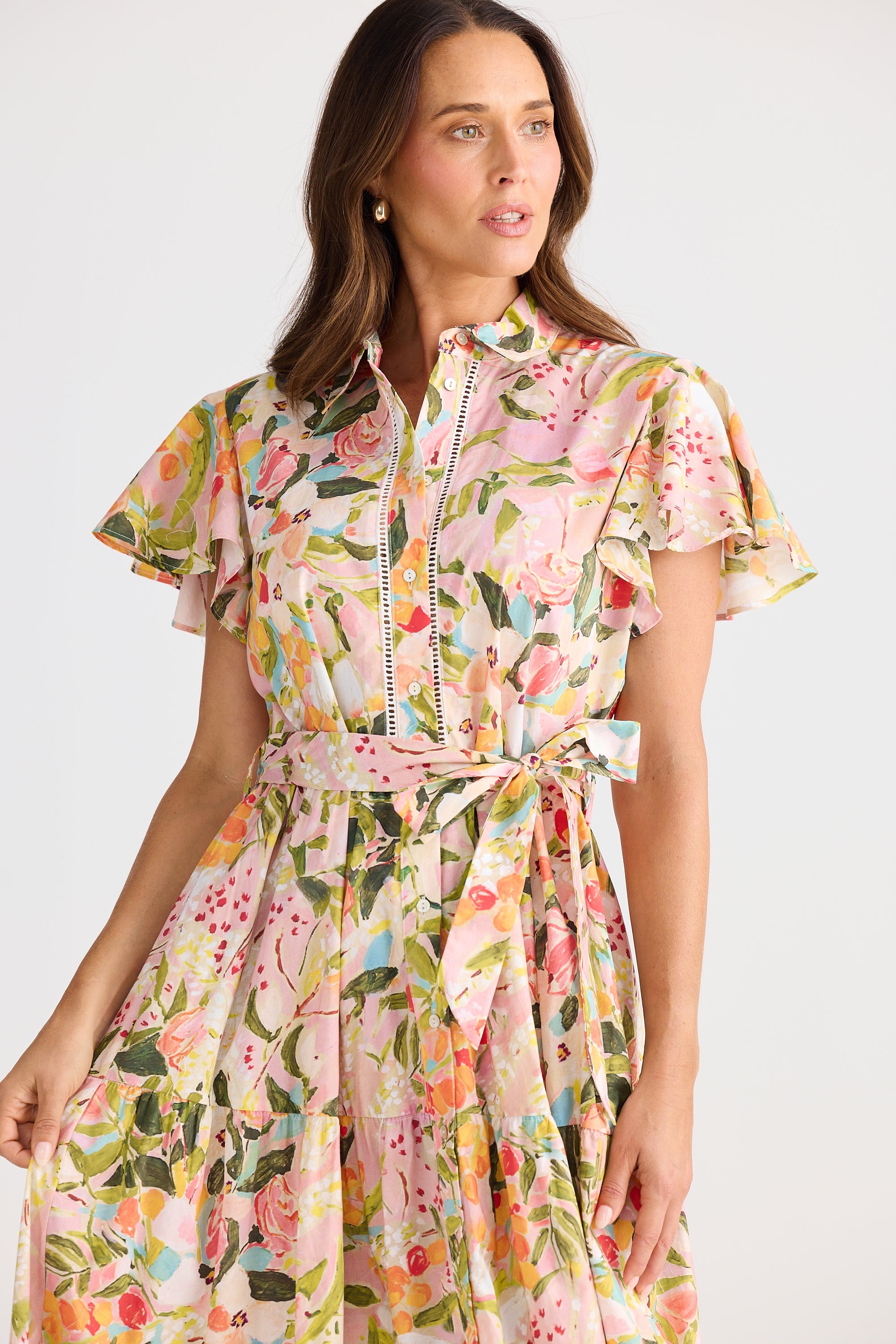 Woman wearing a floral dress on a white background