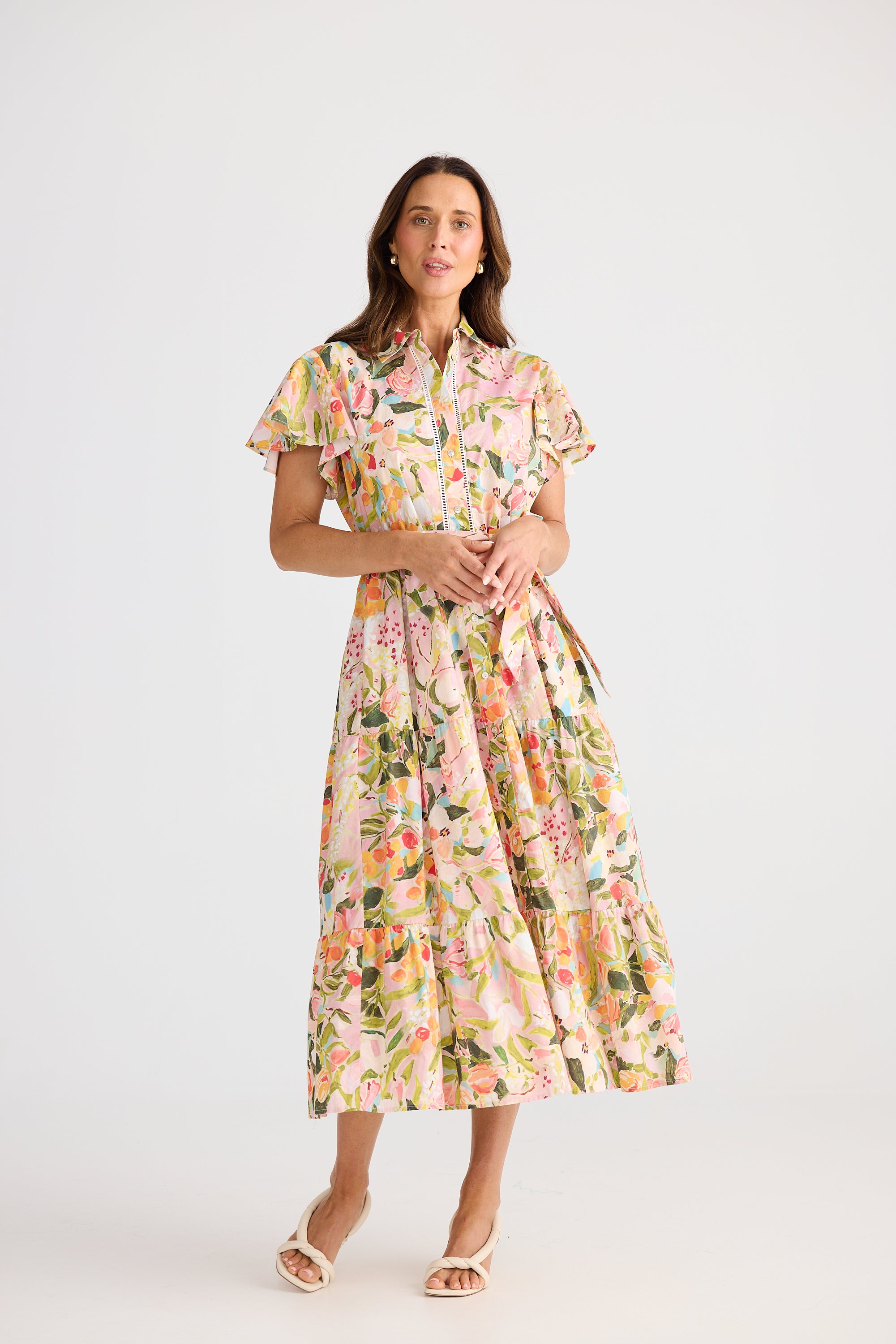 Woman wearing a floral dress on a white background
