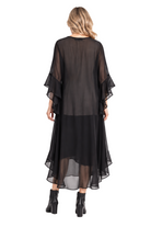 Lady wearing black flowy dress against white background