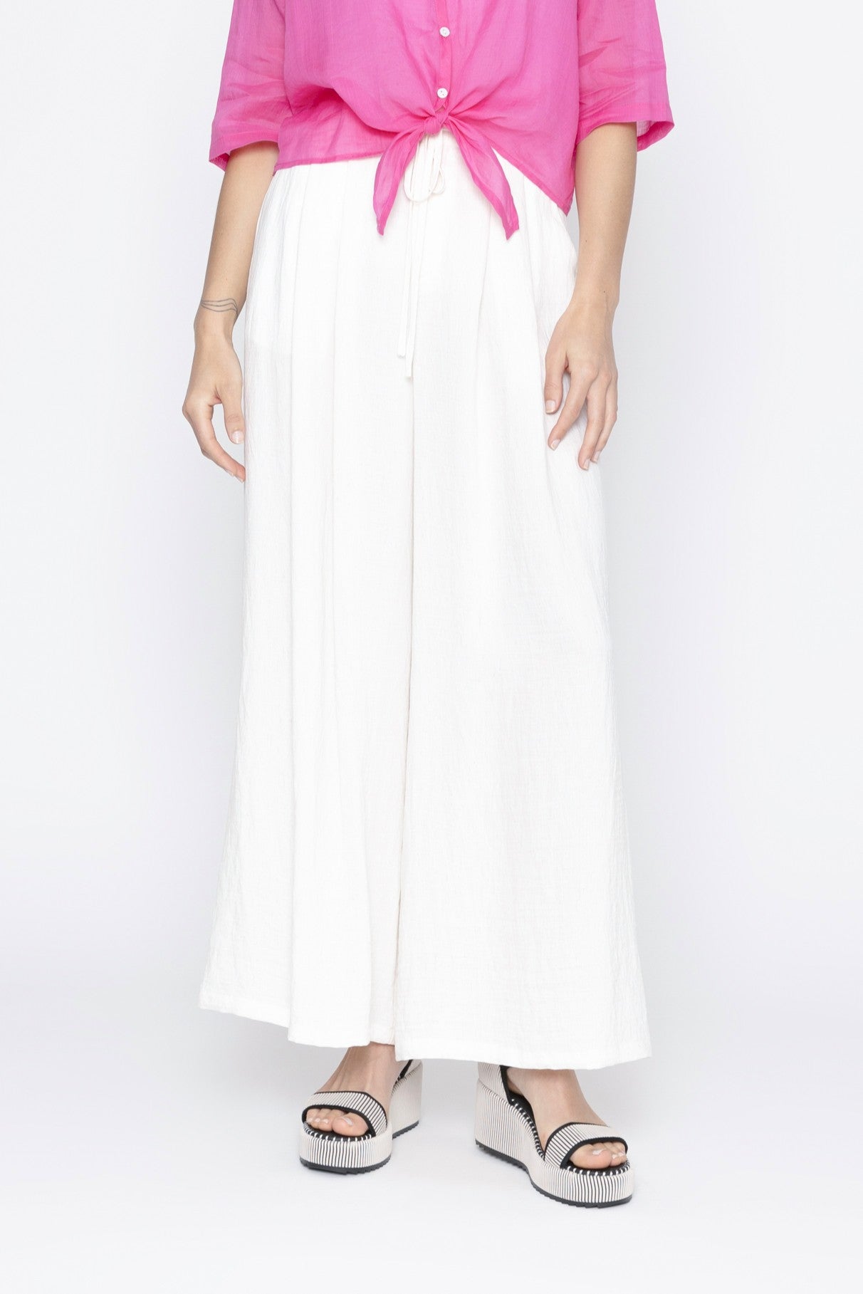 Womens white wide leg pants worn by model
