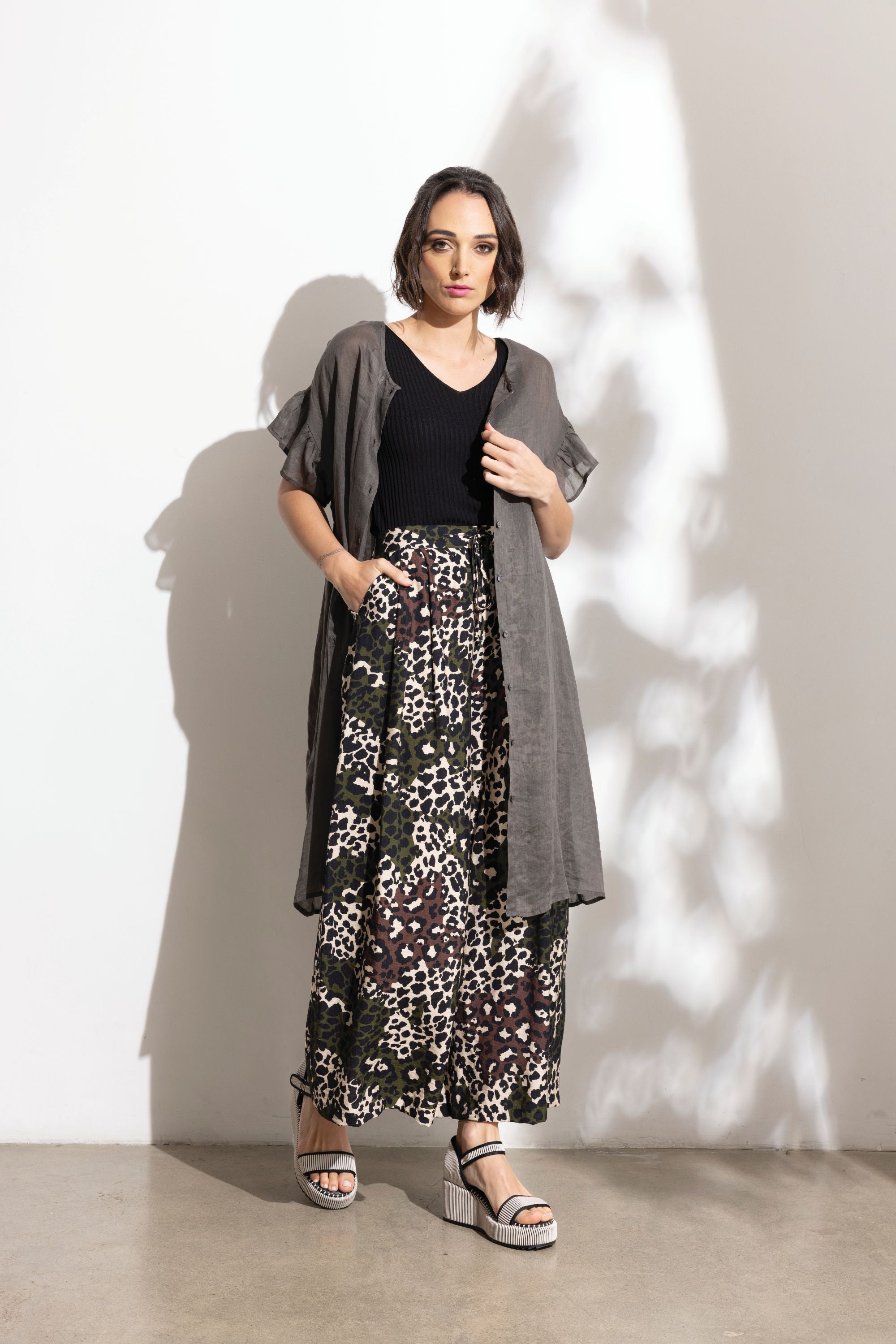 charcoal linen midi dress and patterned pant  worn by model 