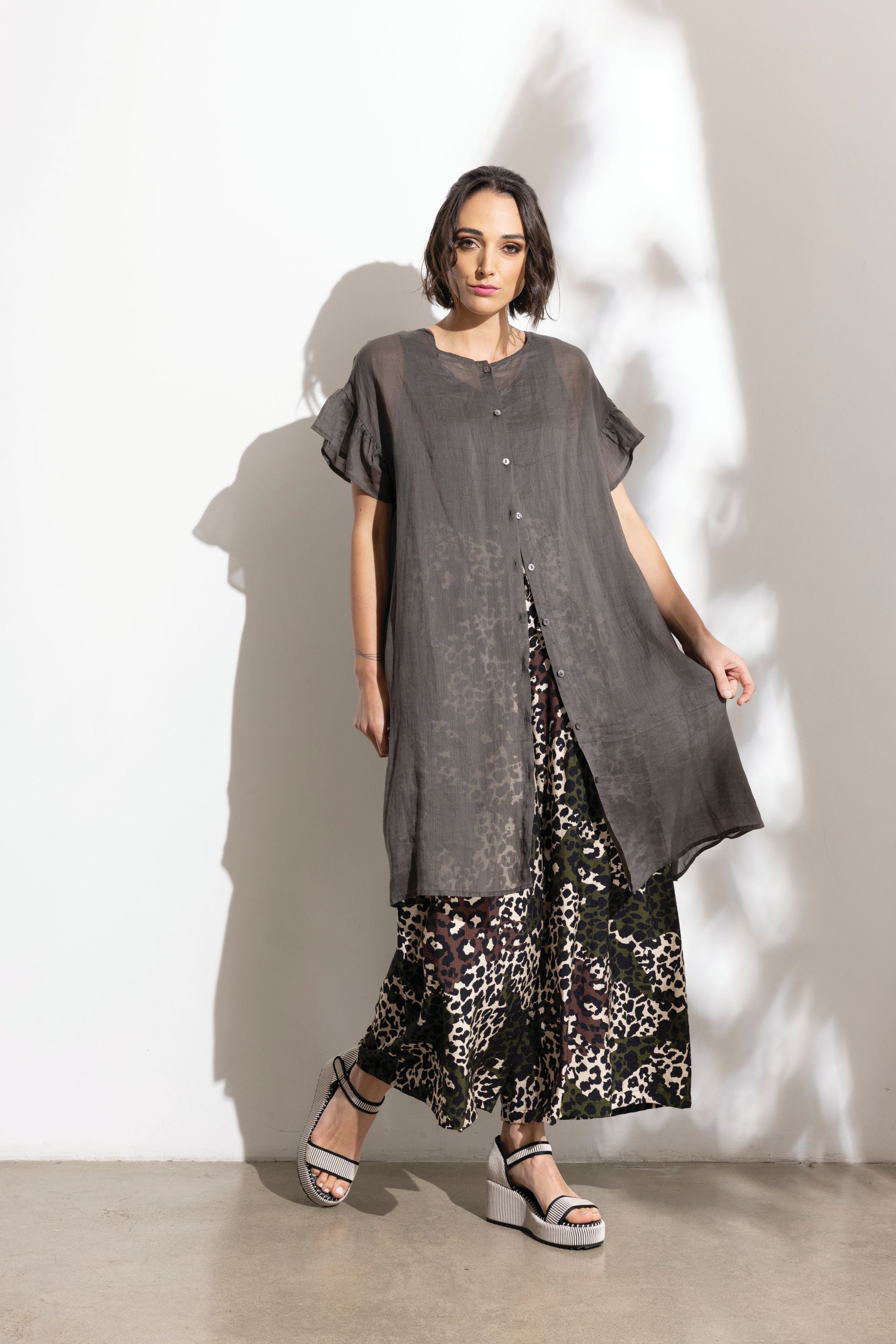 charcoal linen midi dress and patterned pant  worn by model 