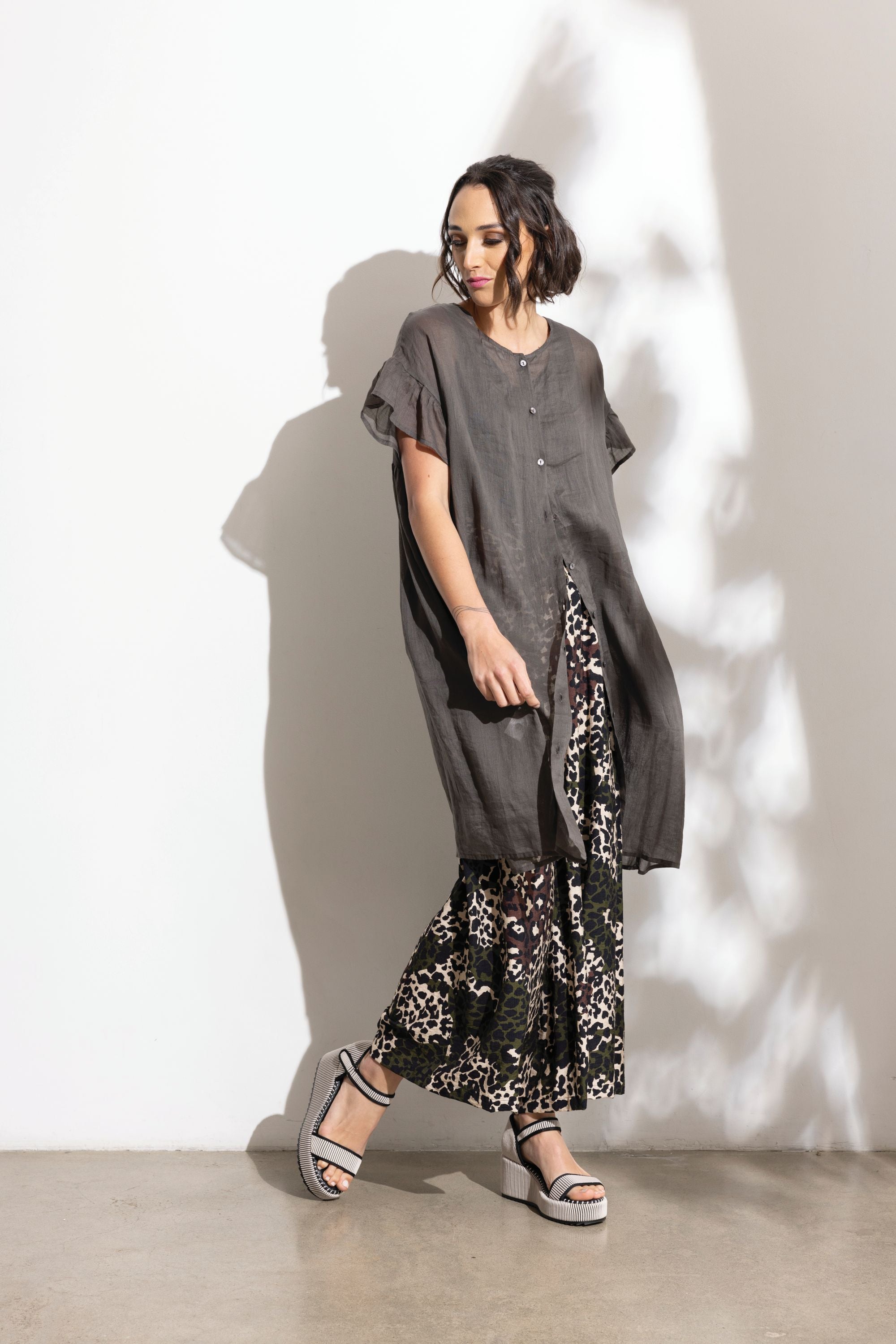 charcoal linen midi dress and patterned pant  worn by model 