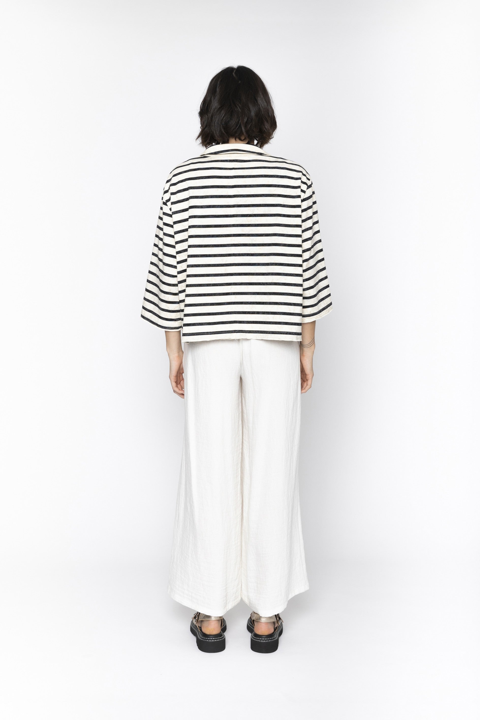 Womens white wide leg pants worn by model back view